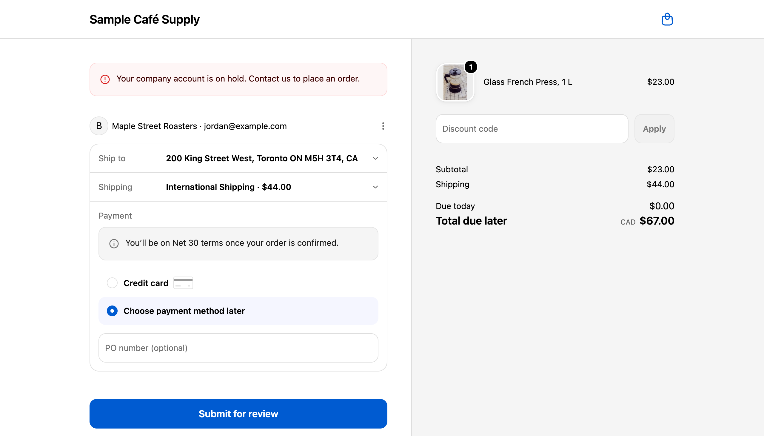 Shopify checkout for a company buyer, with the message Your company account is on hold. Contact us to place an order. above the order details.