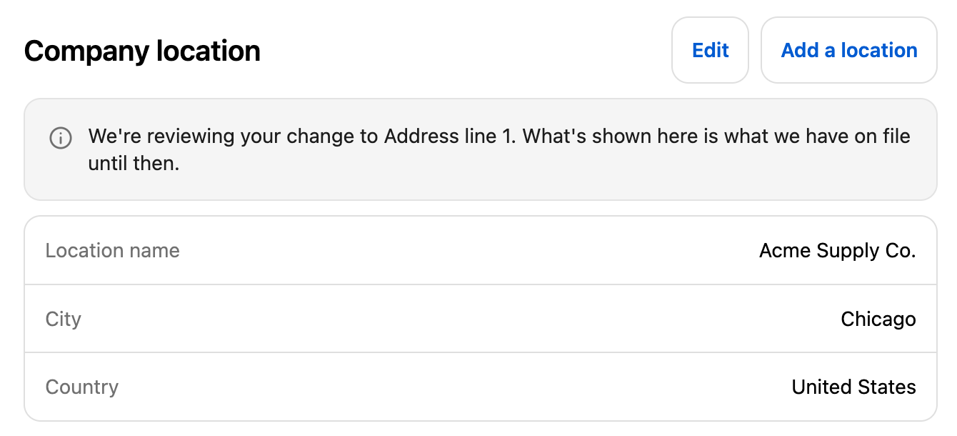 The Company location card on the Manage company page with a note that the change to Address line 1 is being reviewed.